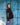 Girl In Black Custom Jacket Infront Of Blue Wall